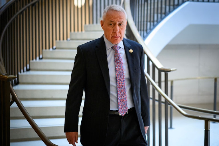 Representative Ken Buck walks down stairs in the Capitol