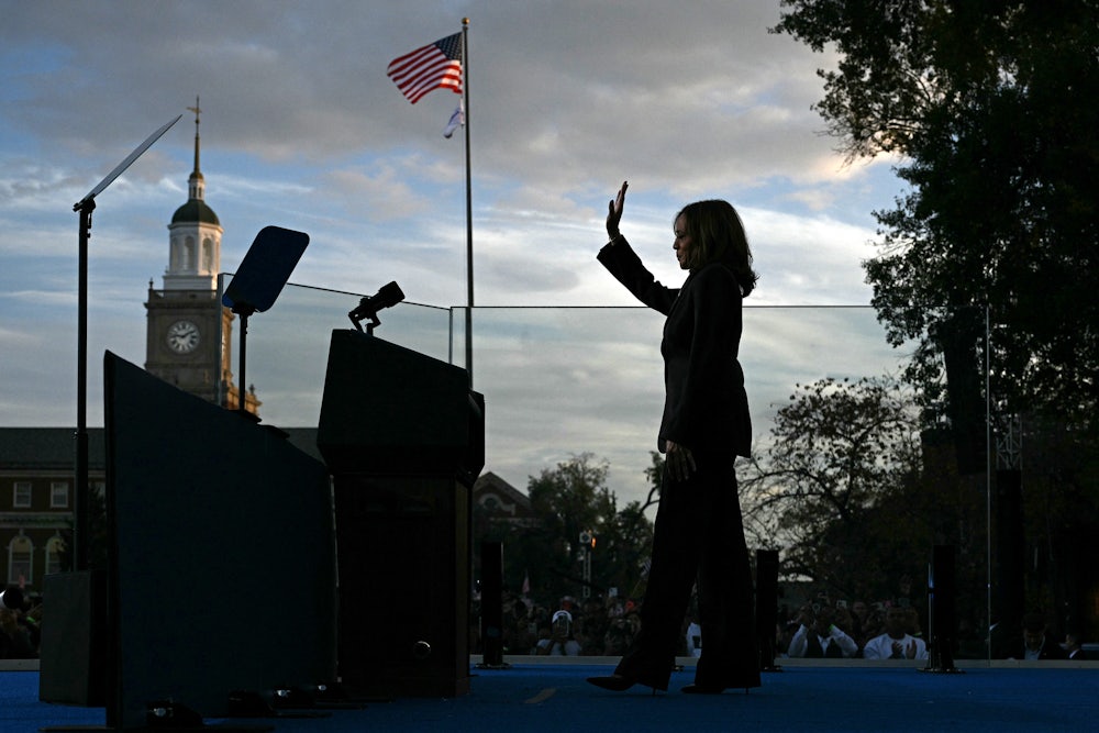 Kamala Harris waves at supporters as she walks off stage after speaking at Howard University in Washington, DC, on November 6, 2024.