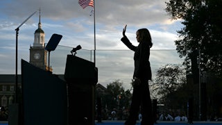 Kamala Harris waves at supporters as she walks off stage after speaking at Howard University in Washington, DC, on November 6, 2024.