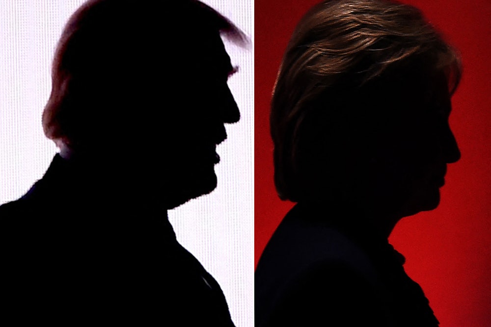 Silhouettes of Donald Trump and Hillary Clinton are seen side by side.