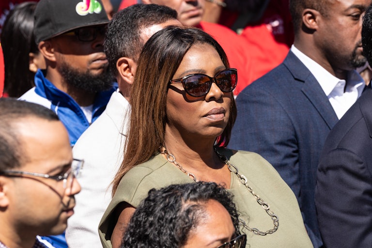 New York Attorney General Letitia James stands in a crowd