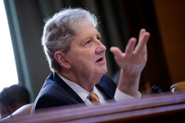 Senator John Kennedy gestures while speaking in a hearing