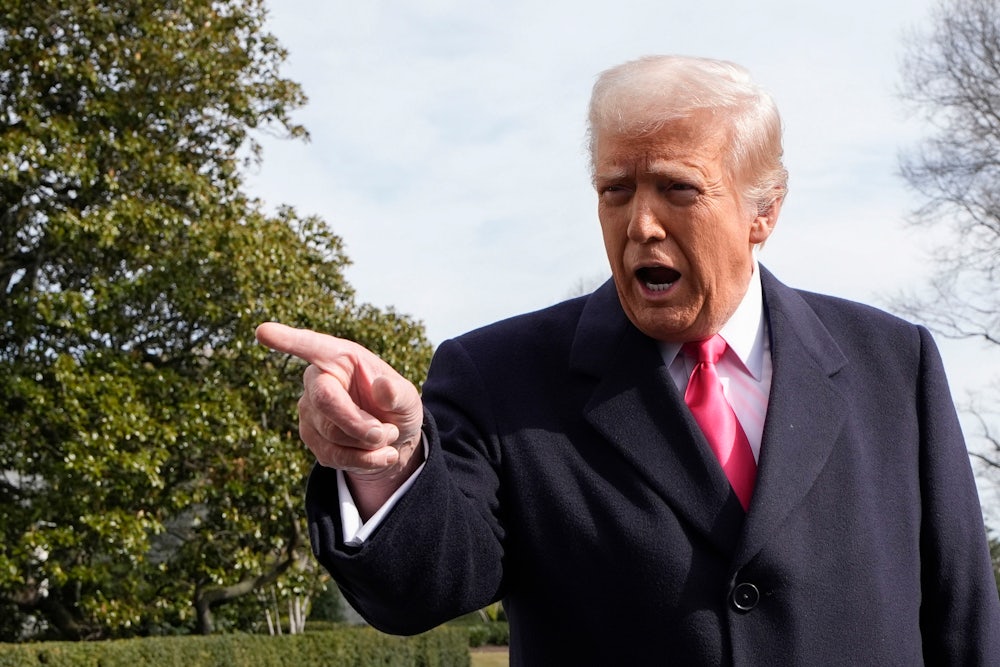 Trump points off camera vigorously while speaking.