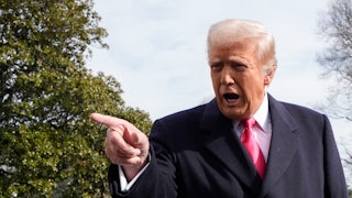 Trump points off camera vigorously while speaking.