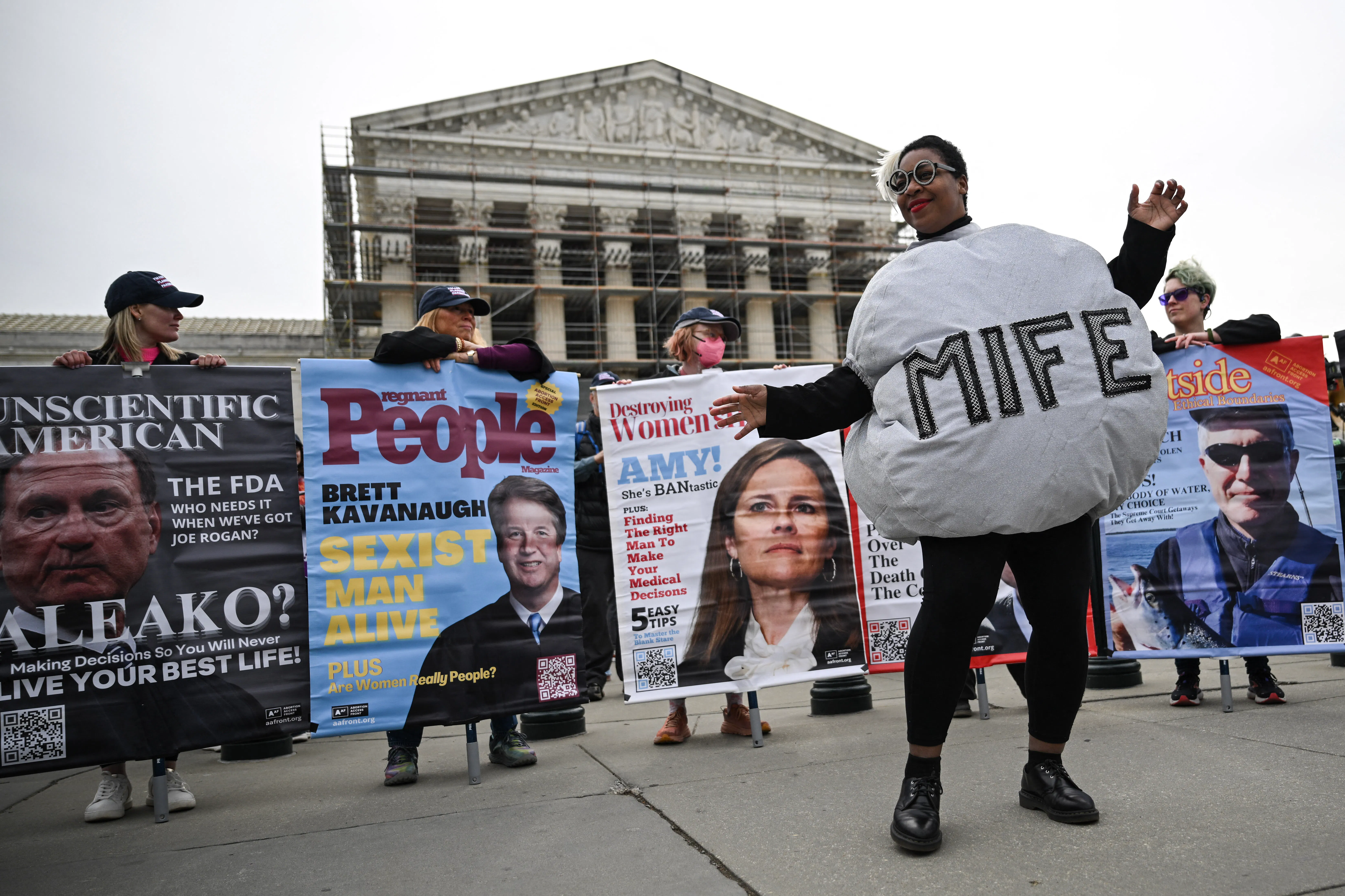 A woman dressed as a mifepristone pill danced with reproductive rights activists during a rally outside the Supreme Court in April 2025. 