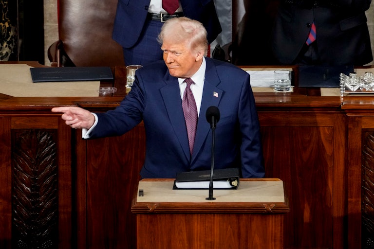 Donald Trump points to the side during his address to a joint session of Congress