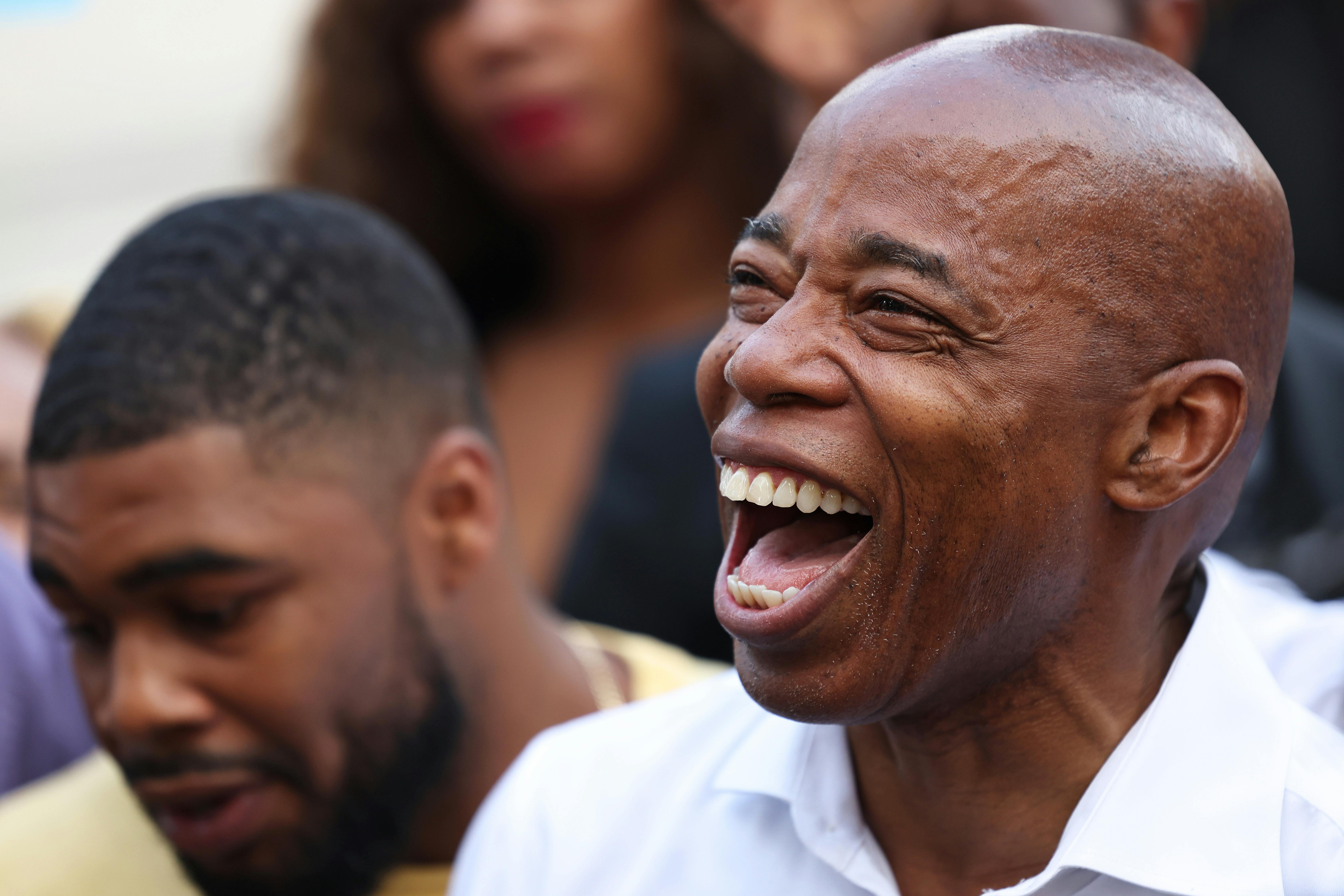 A close up of New York City mayoral frontrunner Eric Adams laughing.