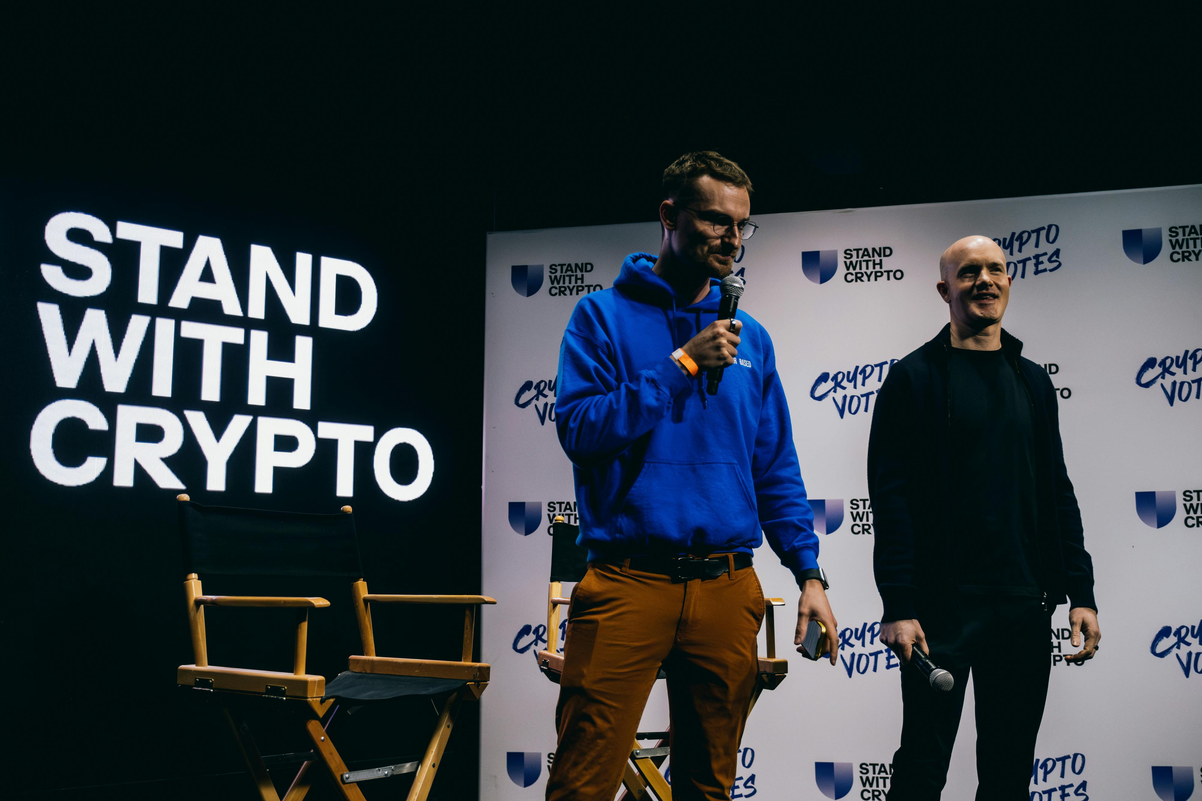 Brian Armstrong (right), chief executive officer of Coinbase Global Inc., works the stage at a "Stand With Crypto" get out the vote rally at The Bourbon Room in Los Angeles in March 2024. 