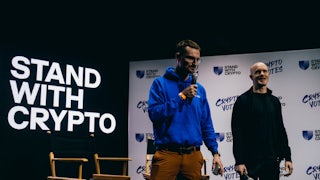 Brian Armstrong (right), chief executive officer of Coinbase Global Inc., works the stage at a "Stand With Crypto" get out the vote rally at The Bourbon Room in Los Angeles in March 2024.