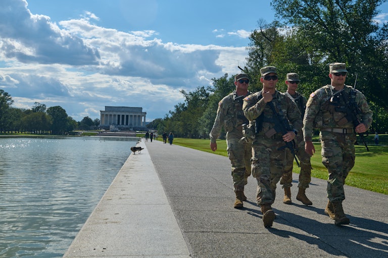 Members of the National Guard walk on the National Mall in Washington, D.C.
