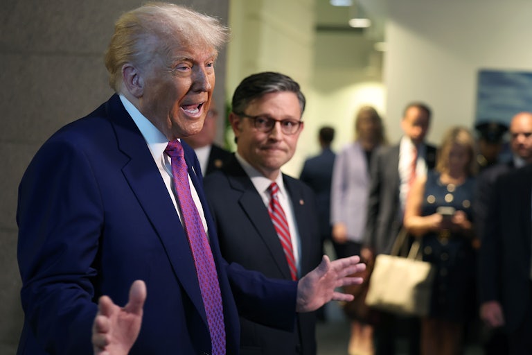 Donald Trump and Mike Johnson speak to reporters in the Capitol about their budget bill.