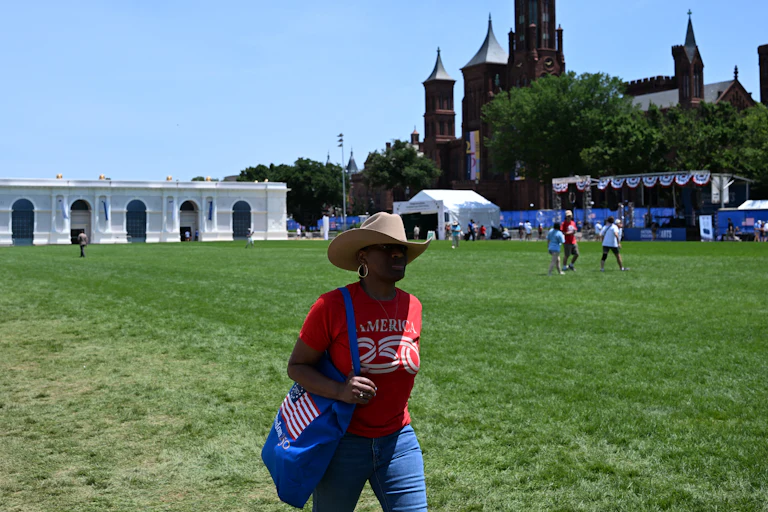 People walk on the grass at the Great American State Fair