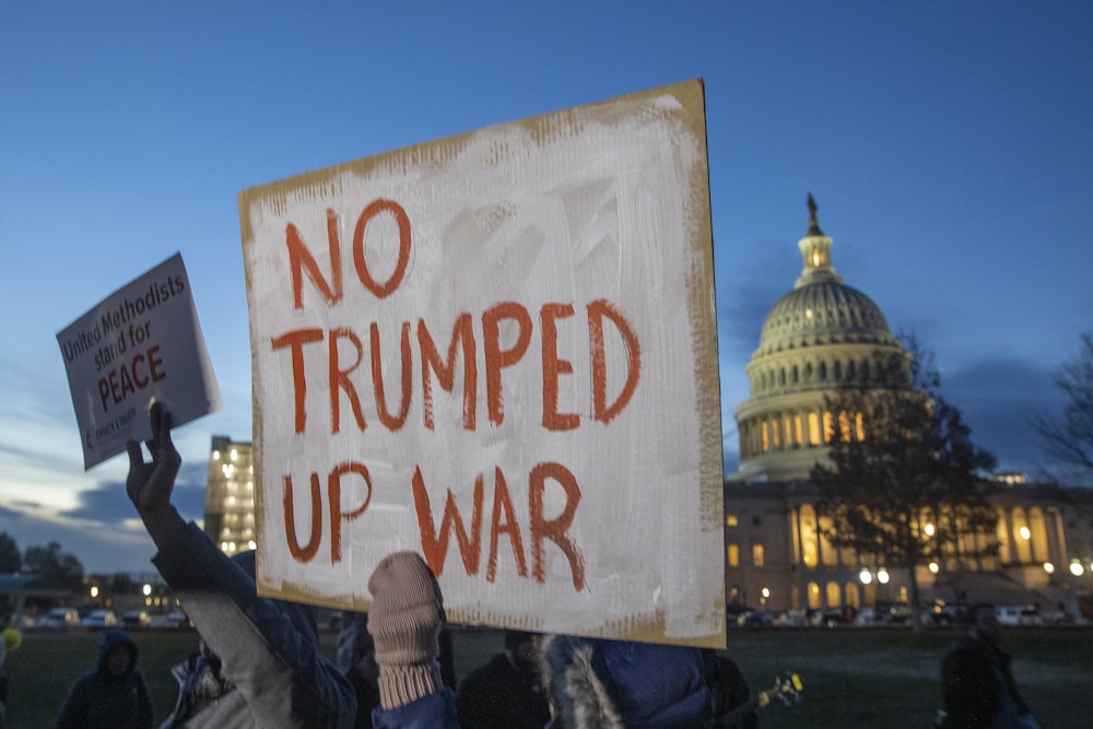 Protesters hold signs at the US Capitol to for the Anti-Iran War Rally on January 2020 in Washington D.C.