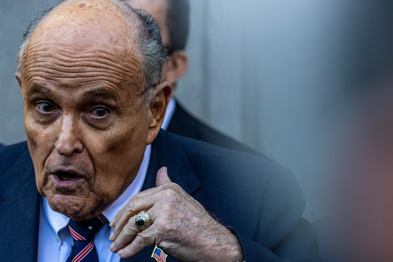 Rudy Giuliani gestures while speaking