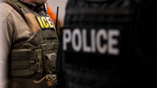 US Immigration and Customs Enforcement (ICE) agents stand in their office before a raid