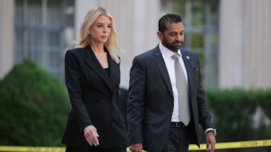Attorney General Pam Bondi and FBI Director Kash Patel walk side by side.
