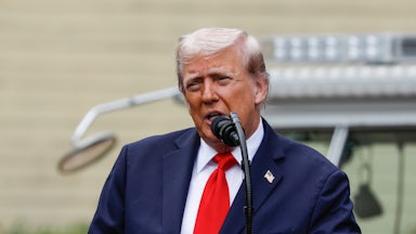 Donald Trump speaks into a microphone