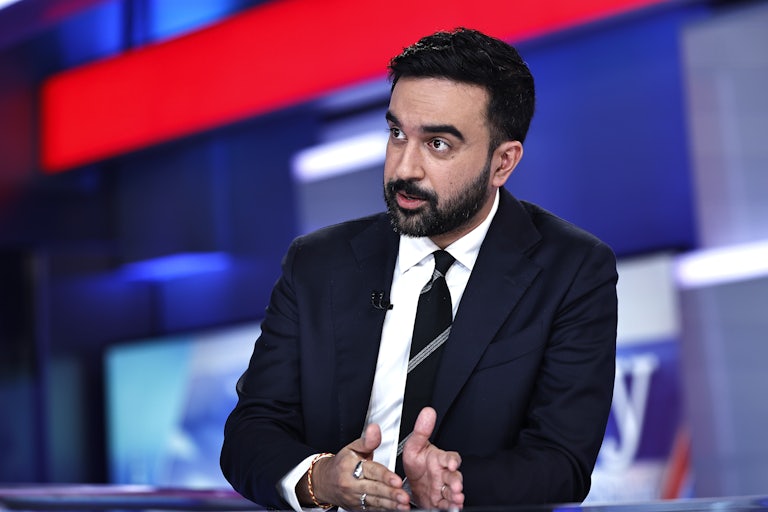 Zohran Mamdani speaks on a news set.