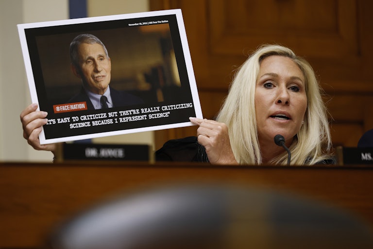 Representative Marjorie Taylor Greene holds up a photograph of Dr. Anthony Fauci while questioning him during a hearing of the House Oversight and Accountability Committee Select Subcommittee on the Coronavirus Pandemic.