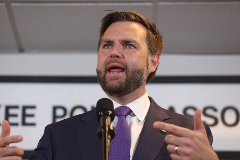 J.D. Vance gestures while speaking at a Donald Trump event