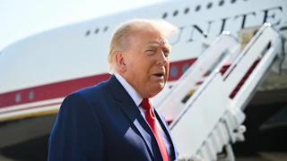Donald Trump speaks to reporters near Air Force One