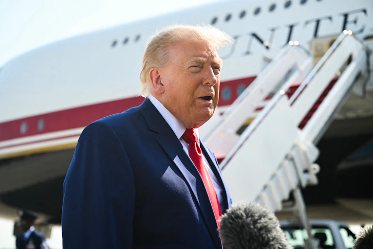 Donald Trump speaks to reporters near Air Force One