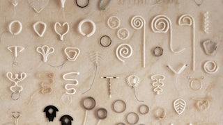 A collection of historical contraceptive devices.