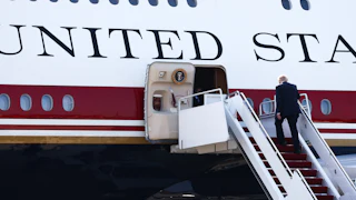 Donald Trump climbs into Air Force One