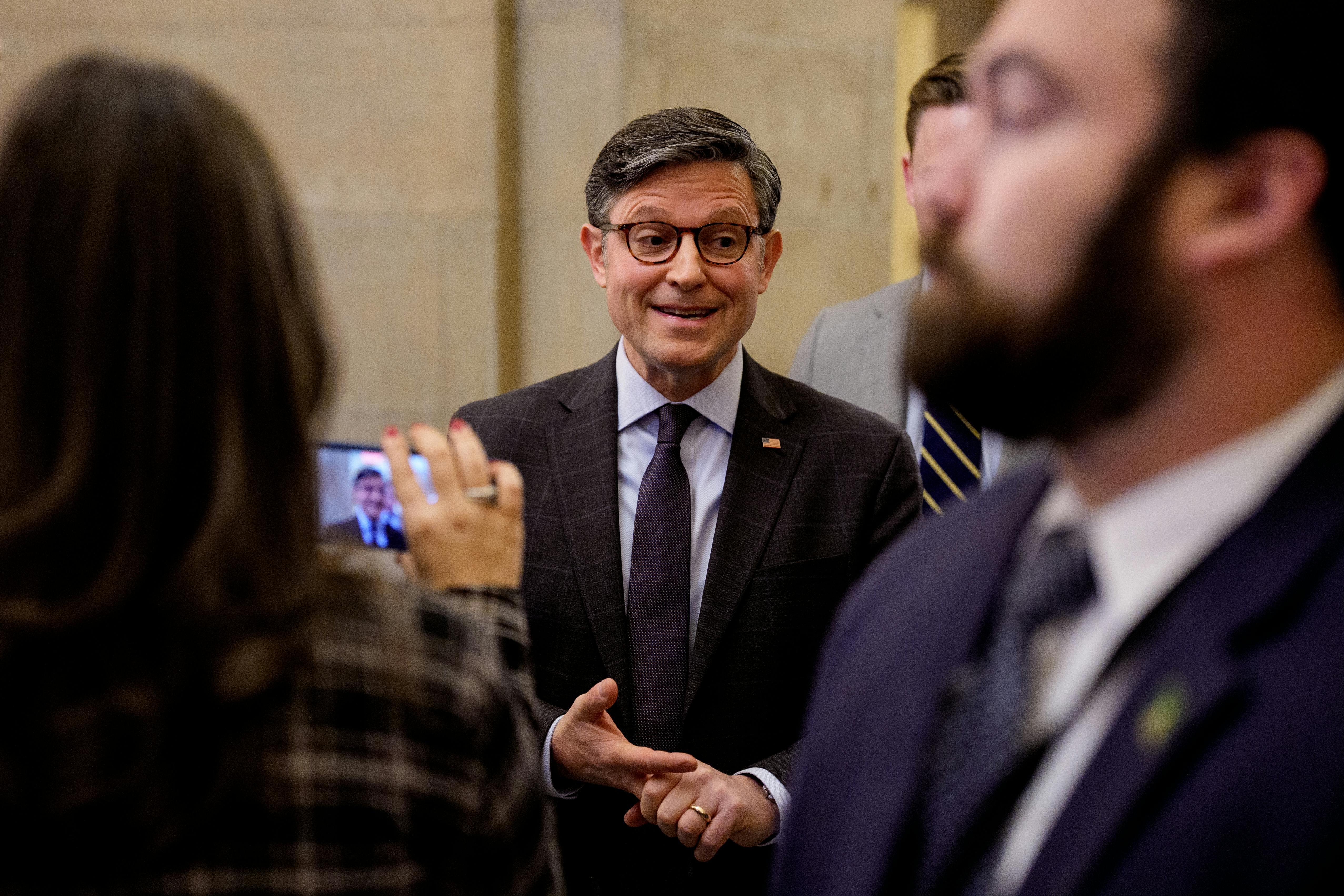 House Speaker Mike Johnson speaks to reporters in the Capitol