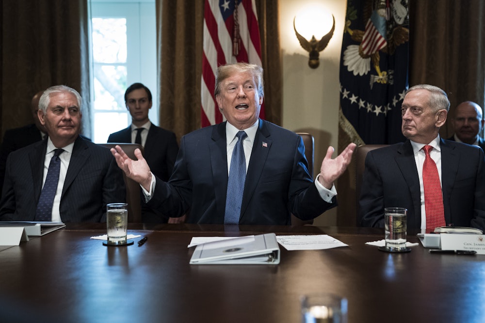 Trump flanked by Secretary of State Rex Tillerson, left, and Defense Secretary Jim Mattis, right, during a Cabinet meeting in 2017