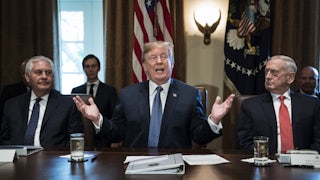 Trump flanked by Secretary of State Rex Tillerson, left, and Defense Secretary Jim Mattis, right, during a Cabinet meeting in 2017