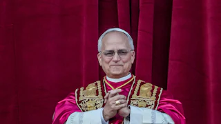 Pope Leo clasps his hands together