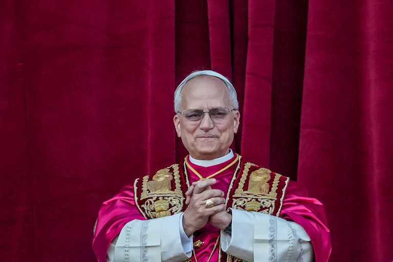 Pope Leo clasps his hands together
