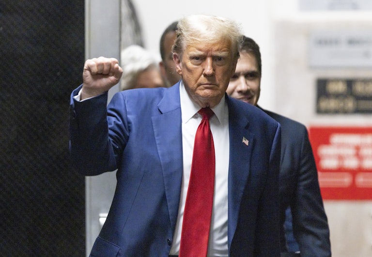 Donald Trump holds up his fist