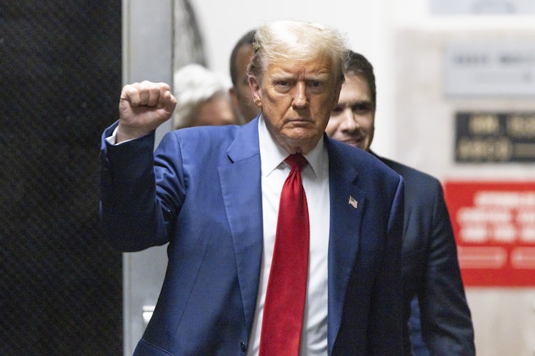 Donald Trump holds up his fist