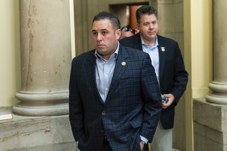 Representative Anthony Eposito in the Capitol, with his hands in his pockets.