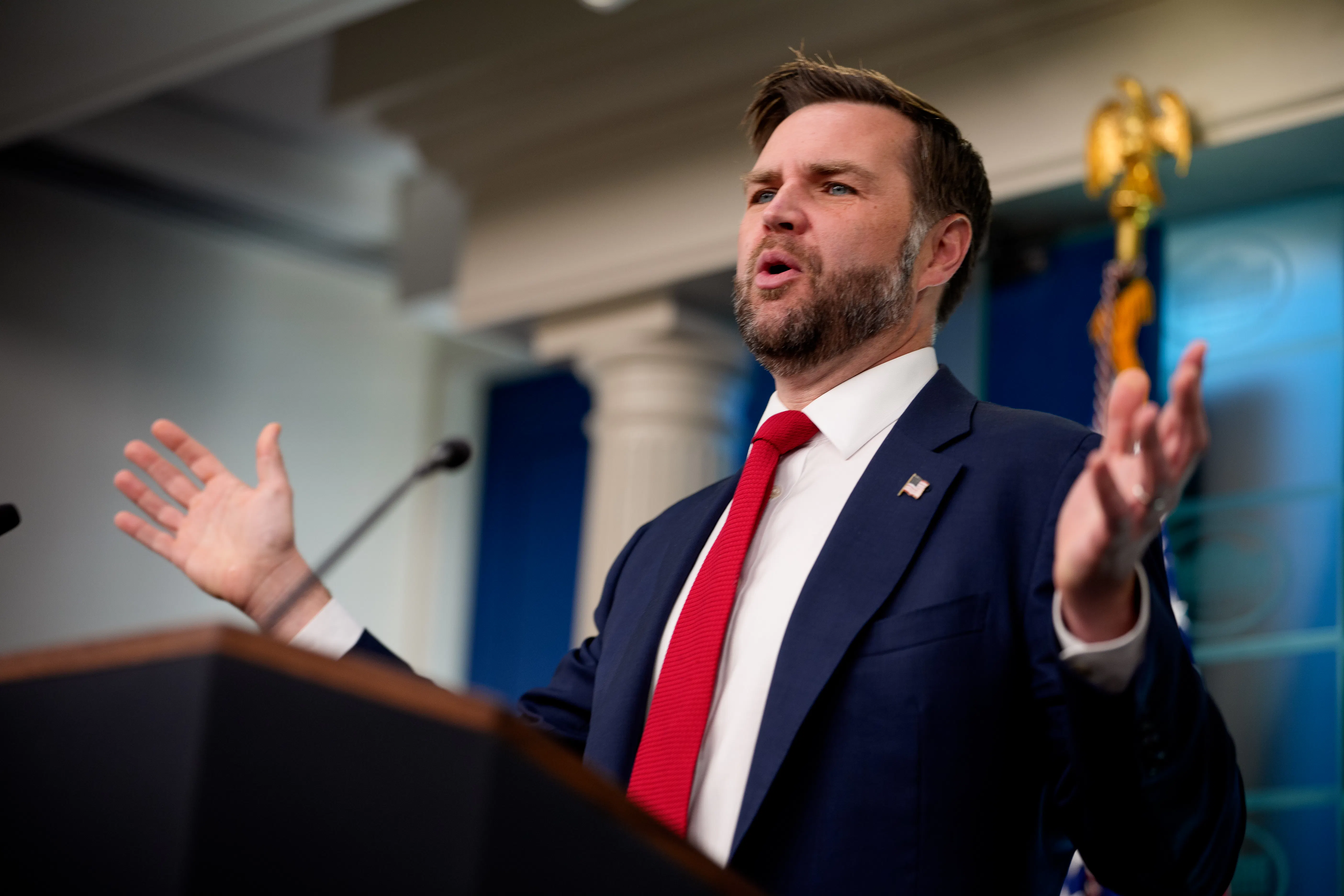 JD Vance speaking at a podium