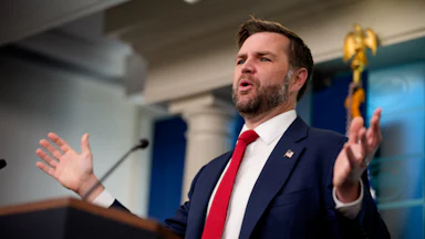 JD Vance speaking at a podium