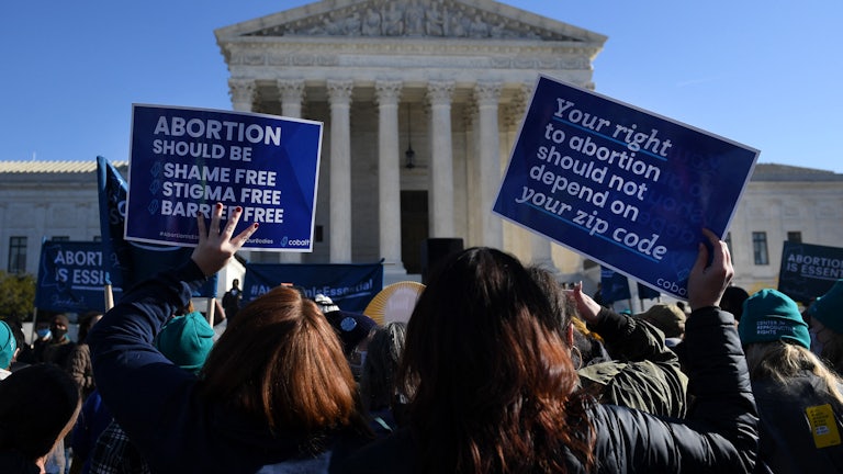 Abortion rights protesters gather outside the Supreme Court.