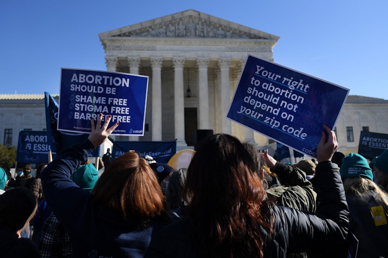 Abortion rights protesters gather outside the Supreme Court.