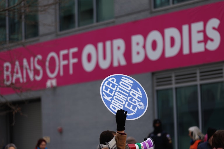 Pro- and anti-abortion protesters stand outside a Planned Parenthood clinic in Washington, D.C.