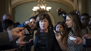 Sen. Susan Collins is surrounded by reporters following a closed-door meeting of Senate Republicans on Capitol Hill.