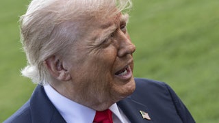 Donald Trump speaks to reporters outside the White House