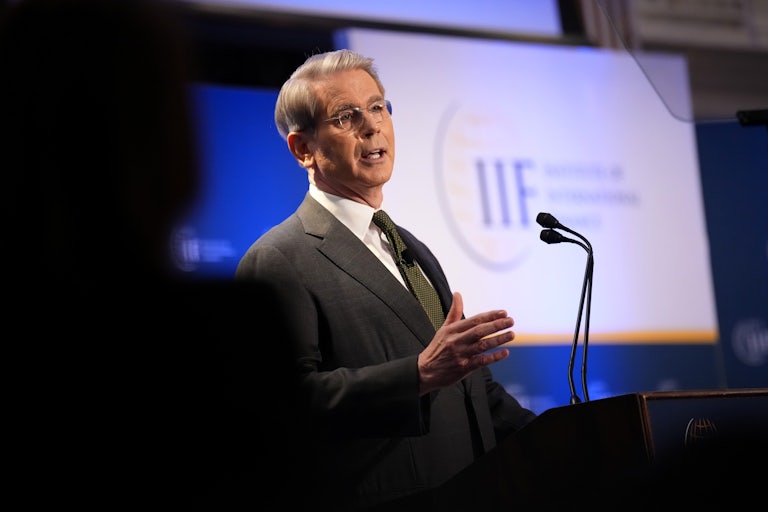 Treasury Secretary Scott Bessent gestures and speaks at a podium during the International Finance Institute Global Outlook Forum