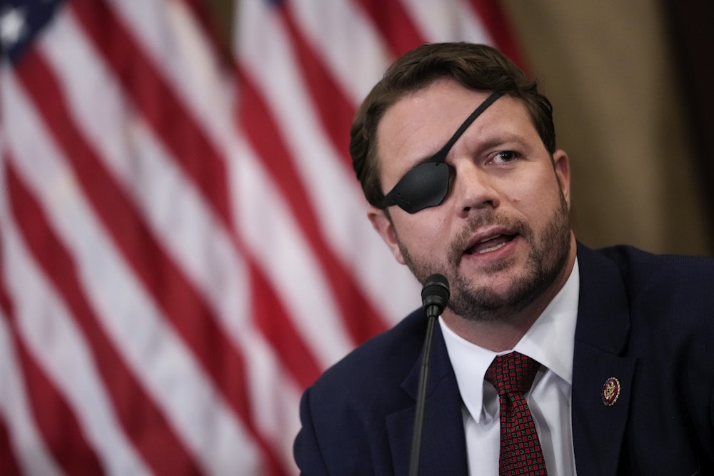 Republican Dan Crenshaw speaks during a meeting of House Republicans.