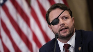 Republican Dan Crenshaw speaks during a meeting of House Republicans.