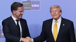 Donald Trump and Mark Rutte shake hands, both smiling