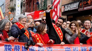 Zohran Mamdani at a Lunar New Year parade with Gov. Kathy Hochul (left) and City Council Speaker Julie Menin (right)