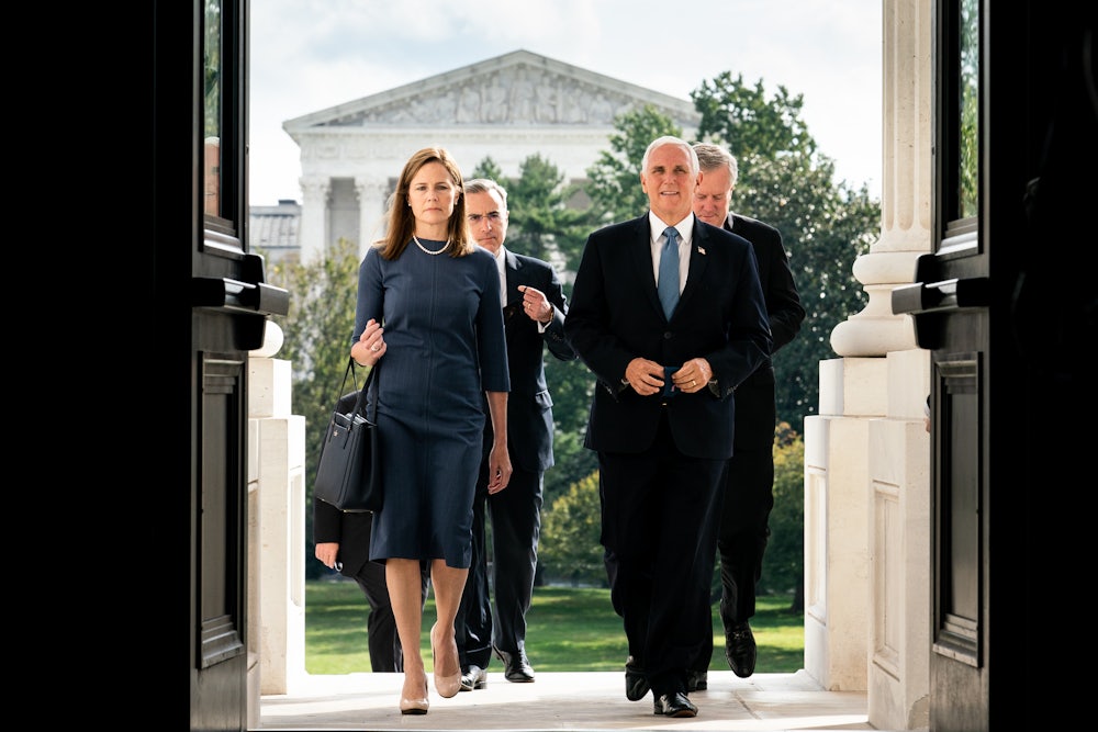 Amy Coney Barrett and Vice President Mike Pence arrive at the U.S. Capitol.