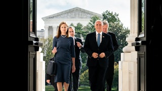 Amy Coney Barrett and Vice President Mike Pence arrive at the U.S. Capitol.